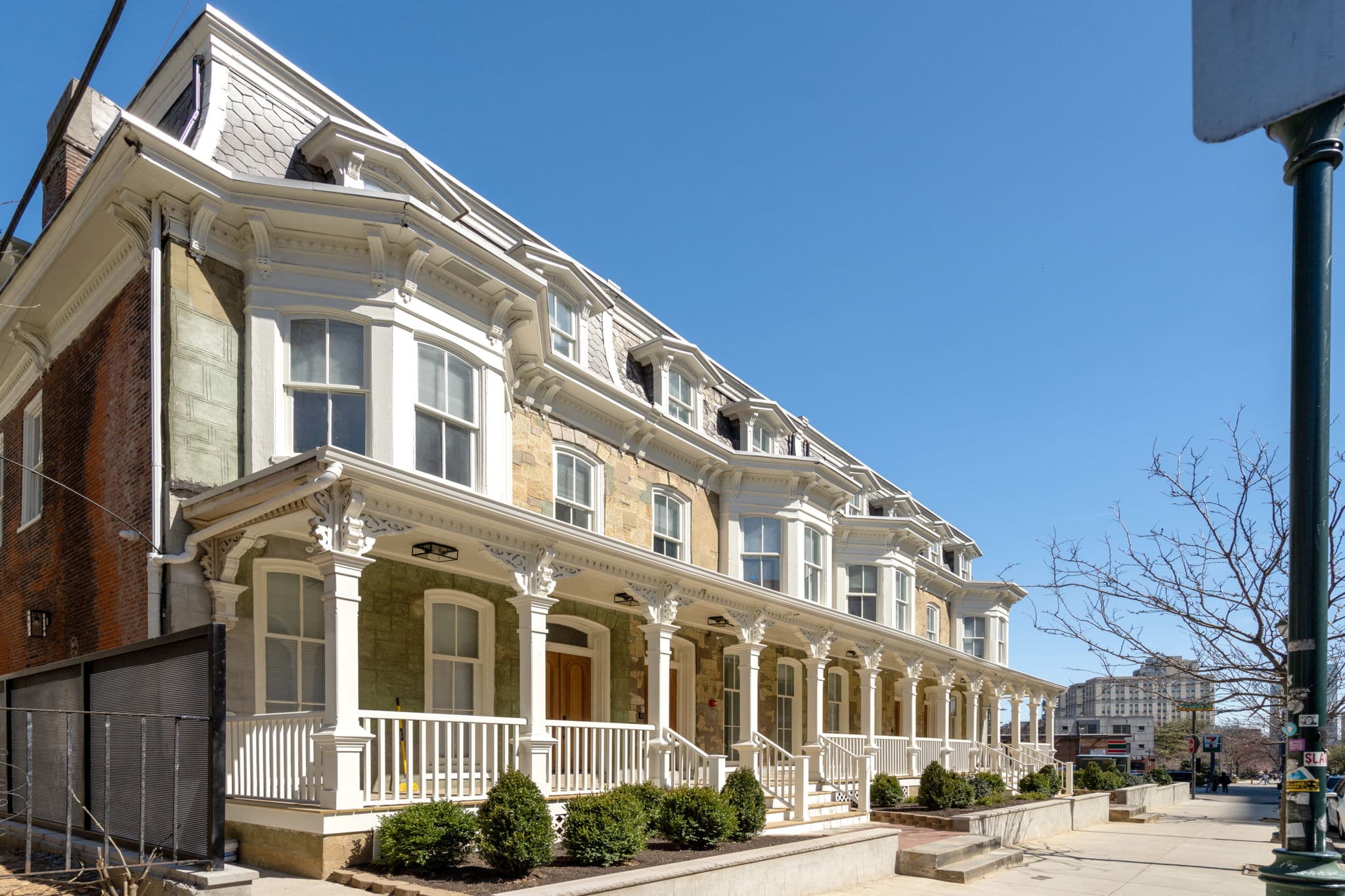 Architectural exterior of Serpentine Apartments at dusk